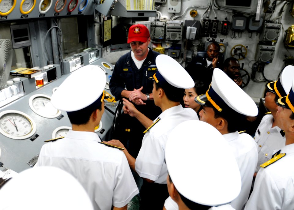 US Navy 091109-N-3830J-221 Lt. Jeffery Hanson shows Vietnam navy officers the engine room's main control during a tour of the U.S. 7th Fleet command ship