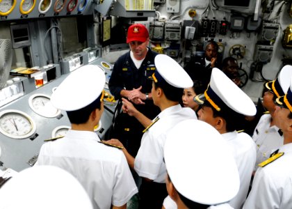 US Navy 091109-N-3830J-221 Lt. Jeffery Hanson shows Vietnam navy officers the engine room's main control during a tour of the U.S. 7th Fleet command ship