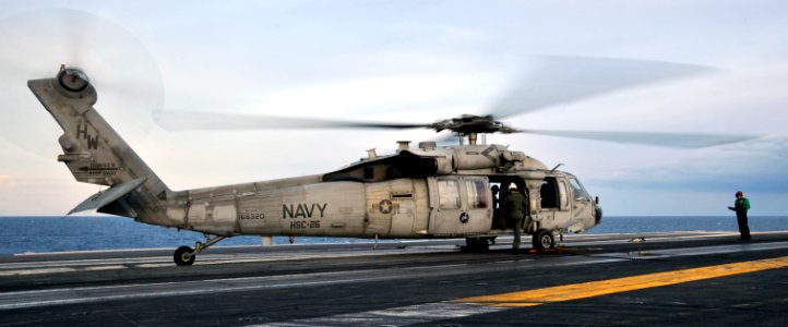 US Navy 091109-N-6003P-006 An MH-60S Sea Hawk helicopter assigned to the Chargers of Helicopter Sea Combat Squadron (HSC) 26 prepares for an early morning flight from the aircraft carrier USS Harry S. Truman (CVN 75)