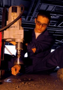 US Navy 091107-N-8913A-067 Machinery Repairman Fireman Chris Wiserma removes a hydrolic fuel tank cap aboard the aircraft carrier USS Harry S. Truman (CVN 75)