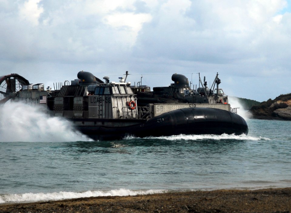 US Navy 091108-N-0807W-132 Landing Craft Air Cushion 58, assigned to Assault Craft Unit (ACU) 5, transports Marine Corps equipment from the amphibious dock landing ship USS Harpers Ferry (LSD 49)