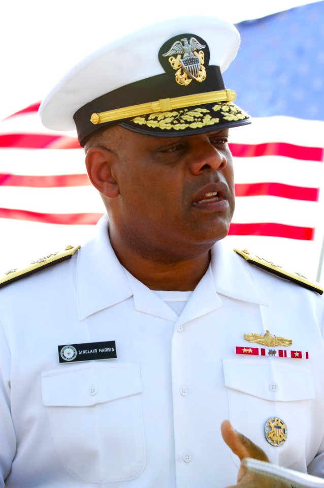 US Navy 091108-N-8053S-209 Rear Adm. Sinclair Harris speaks to local media aboard the guided-missile destroyer USS Benfold (DDG 65) after an assumption of command