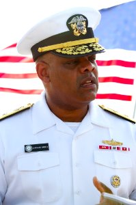 US Navy 091108-N-8053S-209 Rear Adm. Sinclair Harris speaks to local media aboard the guided-missile destroyer USS Benfold (DDG 65) after an assumption of command