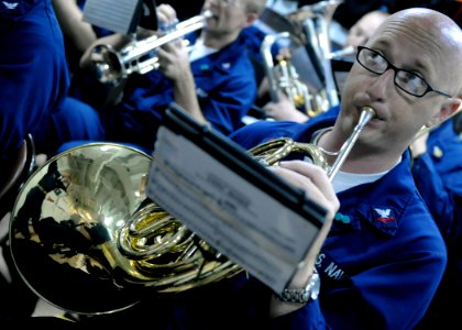 US Navy 091106-N-7478G-157 Musician 2nd Class Anthony Smouse, assigned to the U.S. 7th Fleet Ceremonial Band, takes direction from the conductor during a rehearsal aboard the amphibious command ship USS Blue Ridge (LCC 19)
