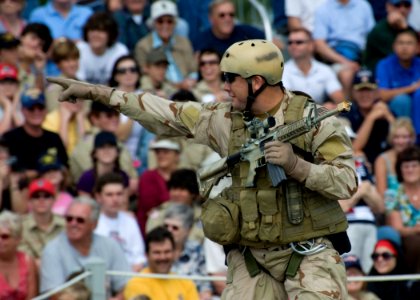 US Navy 091107-N-8689C-074 A Navy SEAL points to members of the crowd during a capabilities demonstration as part of the 2009 Veteran's Day Ceremony and Muster XXIV at the National Navy UDT-SEAL Museum in Fort Pierce, Fla photo