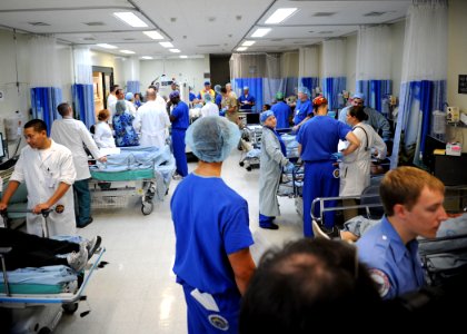US Navy 091110-N-7032B-062 Medical staff at Naval Medical Center San Diego are nearly outnumbered in their operating room by casualties during a command-wide mass casualty drill