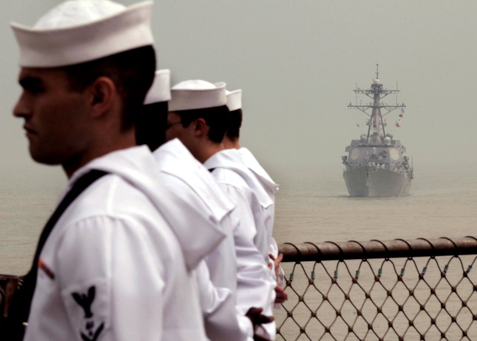 US Navy 091107-N-7478G-225 Sailors assigned to the amphibious command ship USS Blue Ridge (LCC 19) man the rails while the Arleigh Burke-class destroyer USS Lassen (DDG 82) follows behind