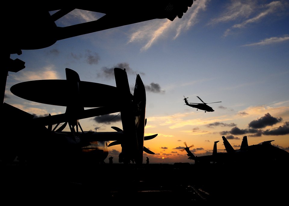 US Navy 091112-N-6233H-010 An SH-60B Sea Hawk helicopter from the Warlords of Helicopter Anti-Submarine Squadron Light (HSL) 51, lifts off at dawn from the flight deck of the aircraft carrier USS George Washington (CVN 73)