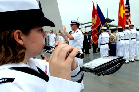 US Navy 091107-N-7478G-227 Musician Seaman Danielle Clark plays the piccolo as the U.S. 7th Fleet ceremonial band plays the national anthems of the U.S. and Vietnam