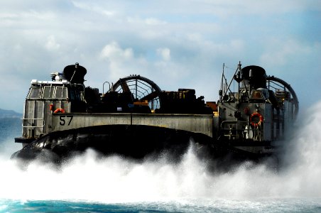 US Navy 091109-N-0807W-224 Landing Craft, Air Cushion 57 transports Marine Corps equipment from the amphibious dock landing ship USS Harpers Ferry (LSD 49) photo