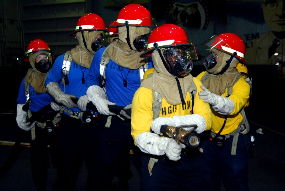 US Navy 091107-N-8913A-015 Sailors aboard the aircraft carrier USS Harry S. Truman (CVN 75) participate in a simulated fire during general quarters training
