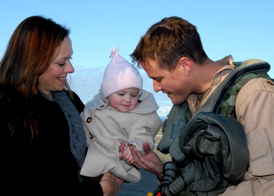 US Navy 091112-N-9860Y-004 Lt. Cmdr. Will Pressley greets his wife and daughter at the Naval Air Station Whidbey Island flight line