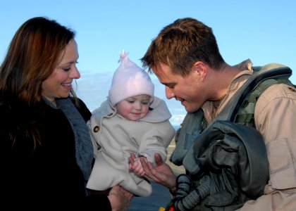 US Navy 091112-N-9860Y-004 Lt. Cmdr. Will Pressley greets his wife and daughter at the Naval Air Station Whidbey Island flight line photo