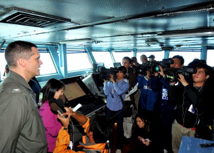 US Navy 091113-N-1062H-009 Capt. David A. Lausman, commanding officer of the aircraft carrier USS George Washington's (CVN 73) is interviewed by Japanese media