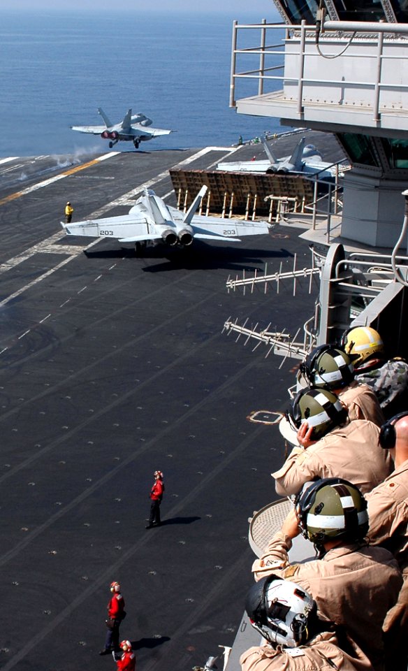 US Navy 091107-N-8960W-006 Visiting pilots from the Australian navy frigate HMAS Toowoomba (FFH 156) observe flight operations from vulture's row aboard the aircraft carrier USS Nimitz (CVN 68)