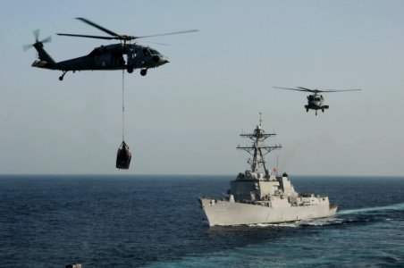 US Navy 091112-N-3038W-374 Two MH-60S Sea Hawk helicopters transfers supplies from USNS Bridge (T-AOE-10) during a replenishment at sea