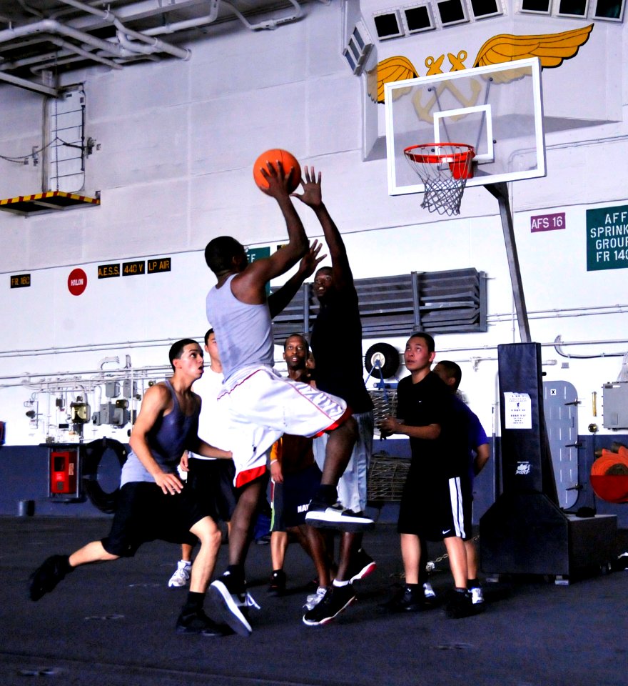 US Navy 091108-N-6003P-005 Sailors aboard the aircraft carrier USS Harry S. Truman (CVN 75) play a game of basketball as part of their physical training