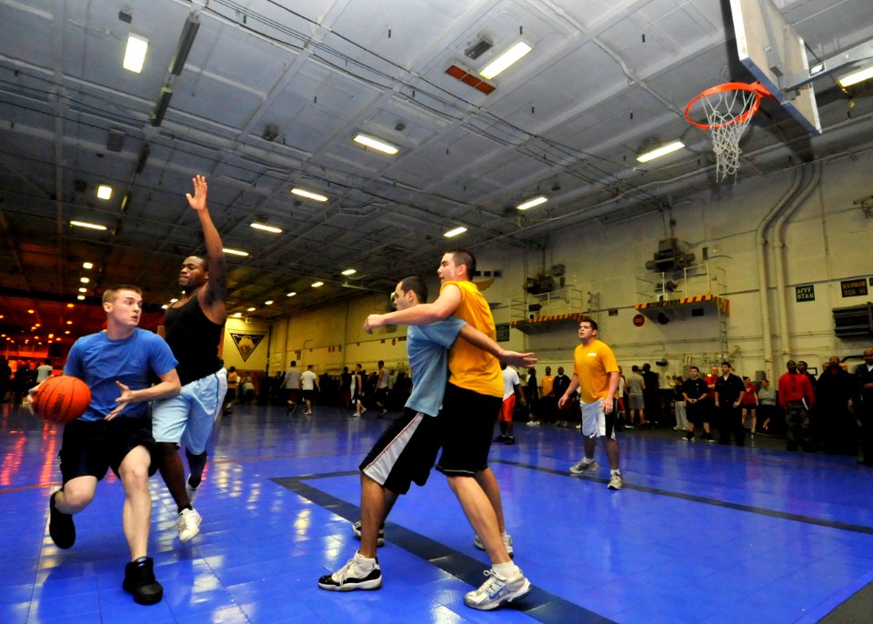 US Navy 091109-N-6003P-013 Sailors aboard the aircraft carrier USS Harry S. Truman (CVN 75) participate in a three-on-three basketball tournament in the ship's hangar bay