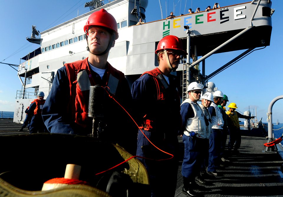 US Navy 091111-N-7280V-359 Sailors assigned to the amphibious command ship USS Blue Ridge (LCC 19) stand by to conduct a replenishment at sea with the Military Sealift Command dry cargo-ammunition ship USNS Richard E. Byrd (T-A
