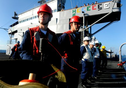 US Navy 091111-N-7280V-359 Sailors assigned to the amphibious command ship USS Blue Ridge (LCC 19) stand by to conduct a replenishment at sea with the Military Sealift Command dry cargo-ammunition ship USNS Richard E. Byrd (T-A