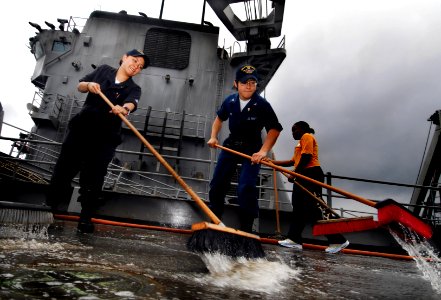 US Navy 091113-N-0807W-327 Sailors aboard USS Harpers Ferry (LSD 49) scrub the weather decks during an aqueous film forming foam countermeasure wash down
