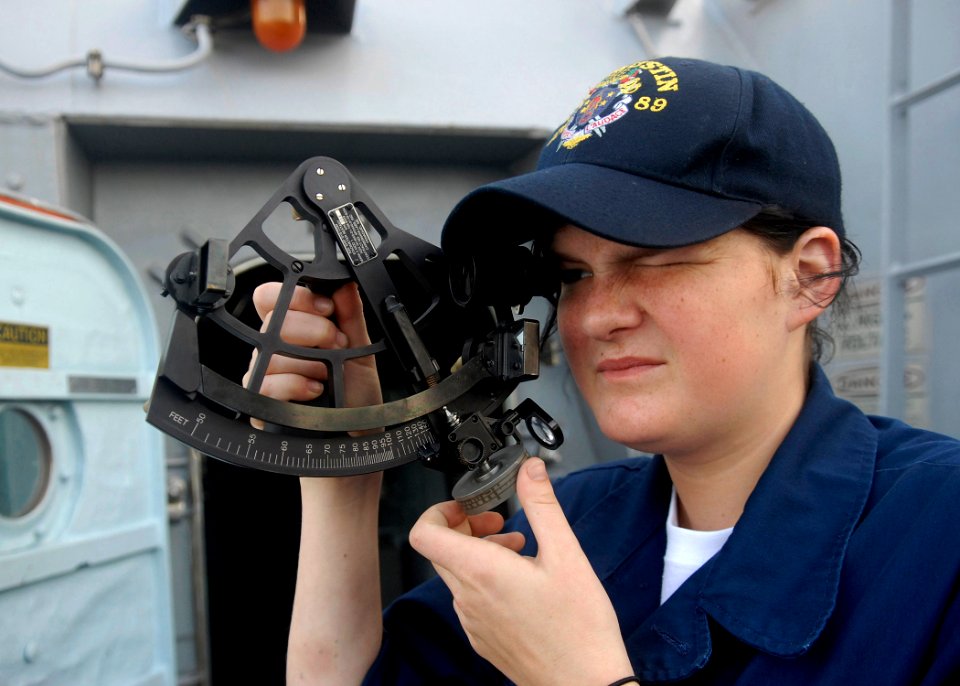 US Navy 091111-N-9520G-002 Quartermaster Seaman Samantha Elwell calculates the range distance as USS Mustin (DDG 89) approaches USNS Rappahannock (T-AO 204)