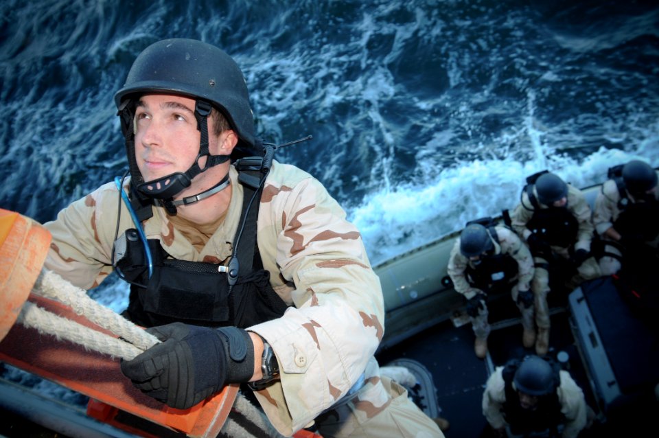 US Navy 091116-N-1522S-002 A Sailor assigned to the guided-missile cruiser USS Hue City (CG 66) climbs the Jacob's ladder during visit, board, search and seizure