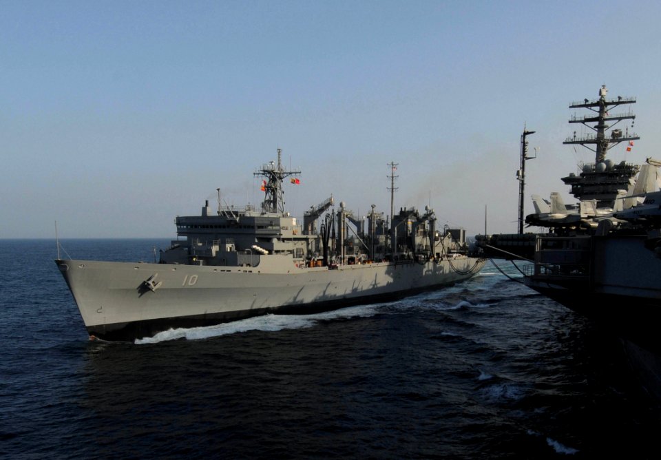 US Navy 091112-N-3038W-305 USNS Bridge (T-AOE-10) cruises alongside USS Nimitz (CVN 68) during a replenishment at sea