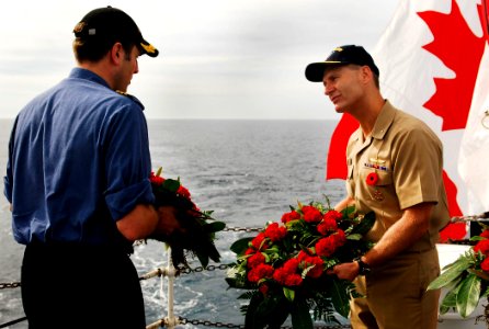 US Navy 091111-N-2610F-137 Rear Adm. Joseph P. Aucoin and Canadian Navy Cmdr. Angus Topshee lay wreaths during Algonquin's Remembrance Day service