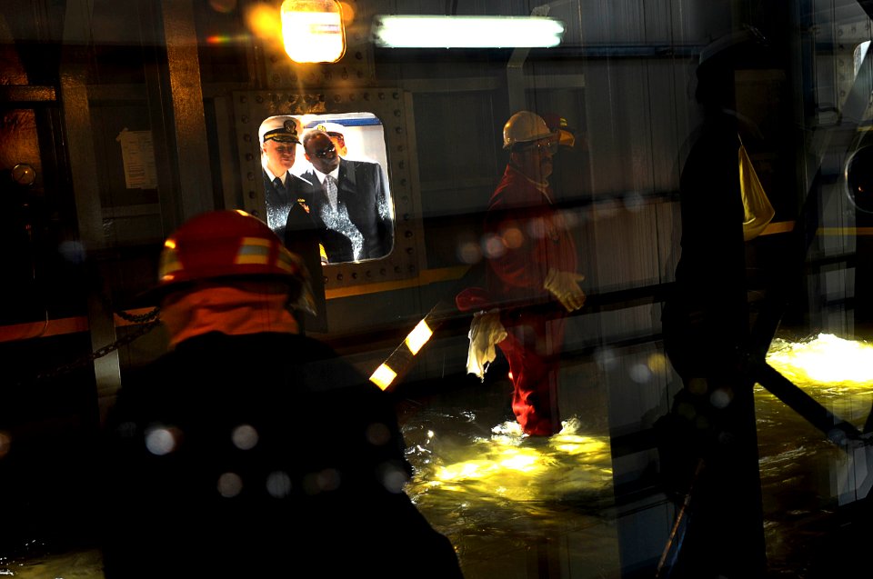 US Navy 091112-N-8273J-143 Chief of Naval Operations Adm. Gary Rouhgead watches a demonstration of the wet trainer at the firefighting school at Abu Qir Naval Base, Alexandria, Egypt