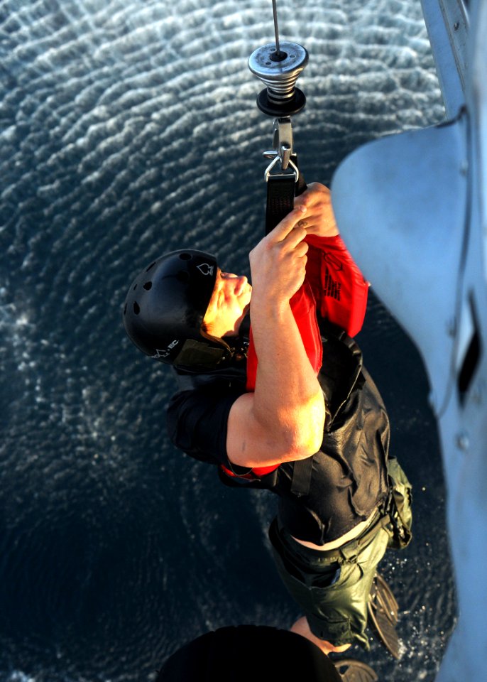 US Navy 091116-N-1291E-122 Explosive Ordnance Disposal Technician 2nd Class Robert Gangeris lifted out of the Persian Gulf onto an SH-60 Sea Hawk helicopter during a joint nations exercise in the Persian Gulf