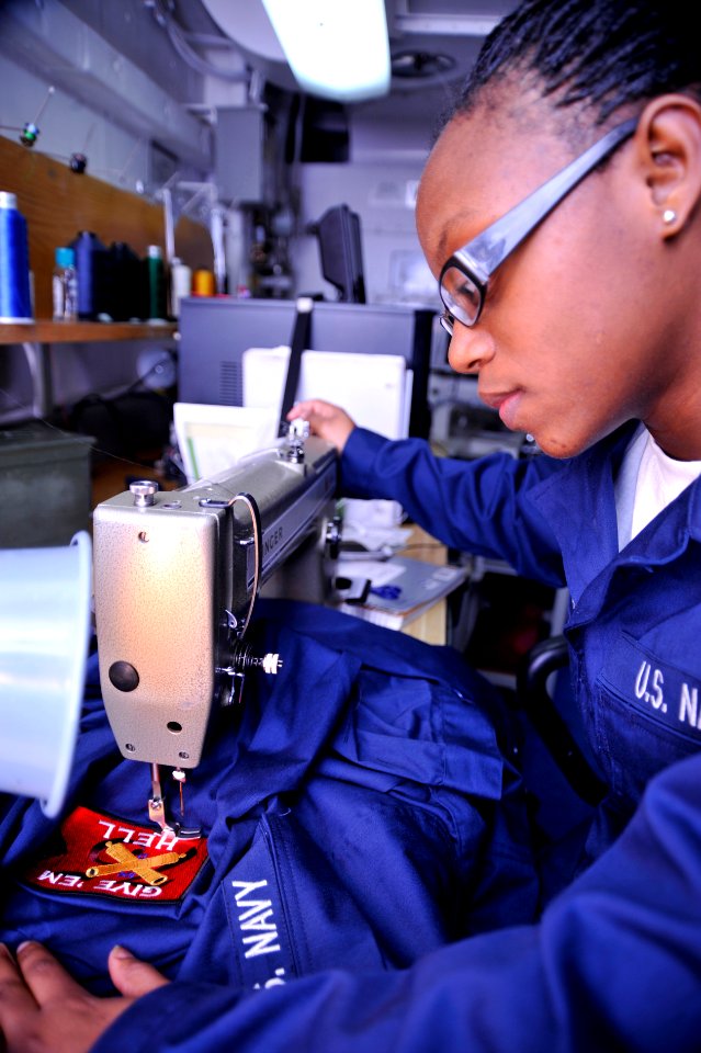 US Navy 091110-N-6003P-008 Seaman Danielle Overstreet stitches a USS Harry S. Truman