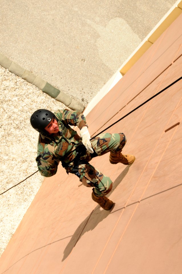 US Navy 091113-N-1906L-002 Explosive Ordnance Disposal Technician 2nd Class Mario Spencer rappels a tower during a basic fast rope certification