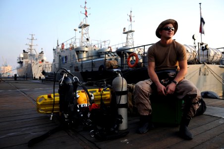 US Navy 091116-N-4154B-002 Navy Diver 2nd Class Zachery Dojaquez waits on the Iraqi Navy pier before a day of diving operations
