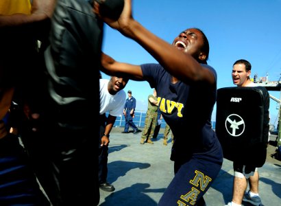 US Navy 091111-N-7280V-672 Boatswain's Mate Seaman Lashaunda Foster demonstrates force protection techniques after getting sprayed with Oleoresin Capsicum during a security reactionary force, non-lethal weapons class