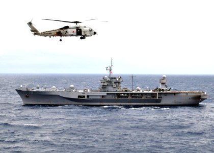US Navy 091117-N-4010S-158 A Japan Maritime Self-Defense Force Mitsubishi SH-60J Sea Hawk helicopter flies over the amphibious command ship USS Blue Ridge (LCC 19) during Annual Exercise (ANNUALEX 21G)