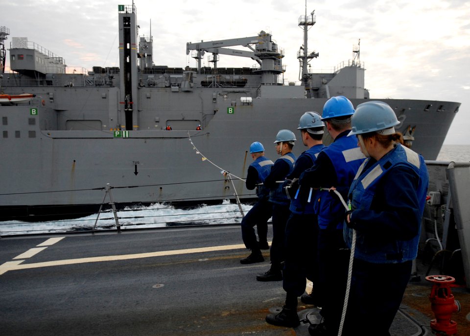US Navy 091116-N-9520G-103 Sailors assigned to the Arleigh Burke-class guided-missile destroyer USS Mustin (DDG 89) man the phone and distance line during an underway replenishment