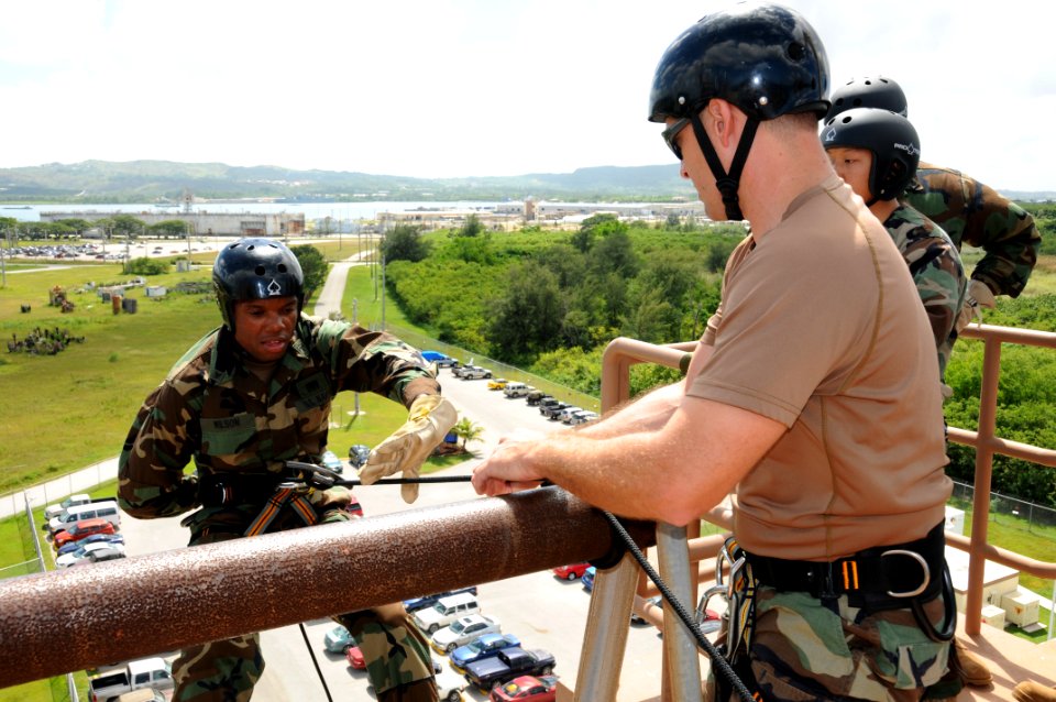 US Navy 091113-N-1906L-004 Hospital Corpsman 3rd Class Joe Wilson makes his way down the rappelling tower during a basic fast rope certification