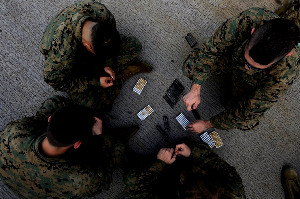 US Navy 091113-N-7280V-298 Marines assigned to Fleet Antiterrorism Security Team Pacific Company, 5th Platoon load 9mm magazines