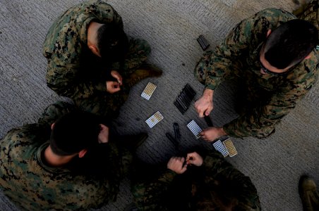 US Navy 091113-N-7280V-298 Marines assigned to Fleet Antiterrorism Security Team Pacific Company, 5th Platoon load 9mm magazines