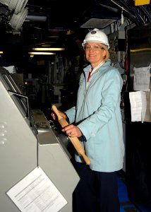 US Navy 091113-N-8560K-083 Susan Ford Bales, daughter of President Gerald R. Ford, stands at the helm of the aircraft carrier USS George H.W. Bush (CVN 77) during a tour of the ship