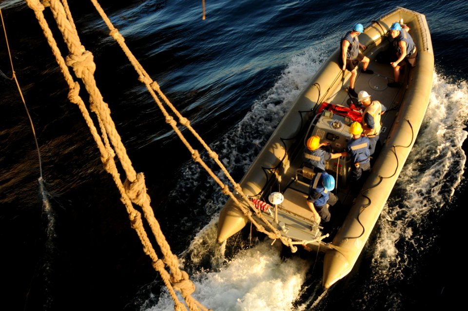 US Navy 091116-N-3038W-052 A rigid hull inflatable boat speeds away from the aircraft carrier USS Nimitz (CVN 68) after being lowered into the water during small boat operations