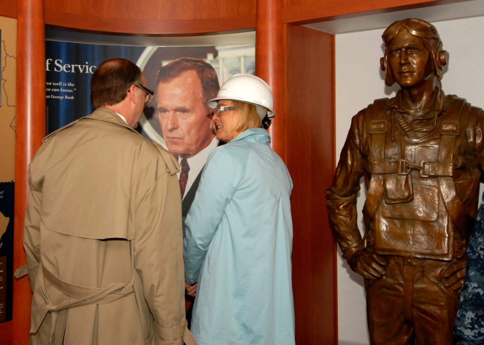 US Navy 091113-N-8560K-113 Susan Ford Bales, daughter of President Gerald R. Ford, and Greg Willard, a Ford family representative, tour the tribute room aboard the aircraft carrier USS George H.W. Bush (CVN 77)