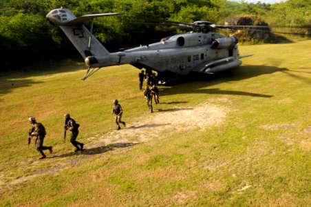 US Navy 091113-N-0890S-486 U.S. Marines and members of the Dominican Republic military deploy from a CH-53 Sea Stallion helicopter