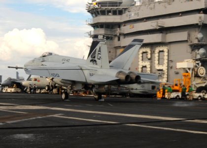US Navy 091118-N-9988F-003 Cmdr. Joe Barnes, executive officer of Strike Fighter Squadron (VFA) 143, lands aboard the aircraft carrier USS Dwight D. Eisenhower (CVN 69) during his 1,000th career arrested recovery