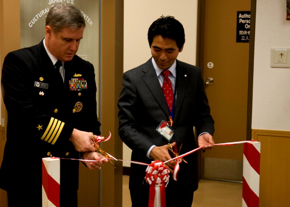 US Navy 091118-N-2638R-002 Capt. Daniel Weed Mayor of Yokosuka City, Yuto Yoshida, cut the ceremonial ribbon during the grand opening ceremony