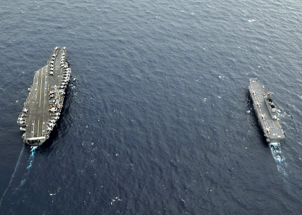 US Navy 091117-N-6233H-234 The aircraft carrier USS George Washington (CVN 73) and the Japan Maritime Self-Defense Force helicopter destroyer JS Hyuga (DDH 181) transit the Pacific Ocean