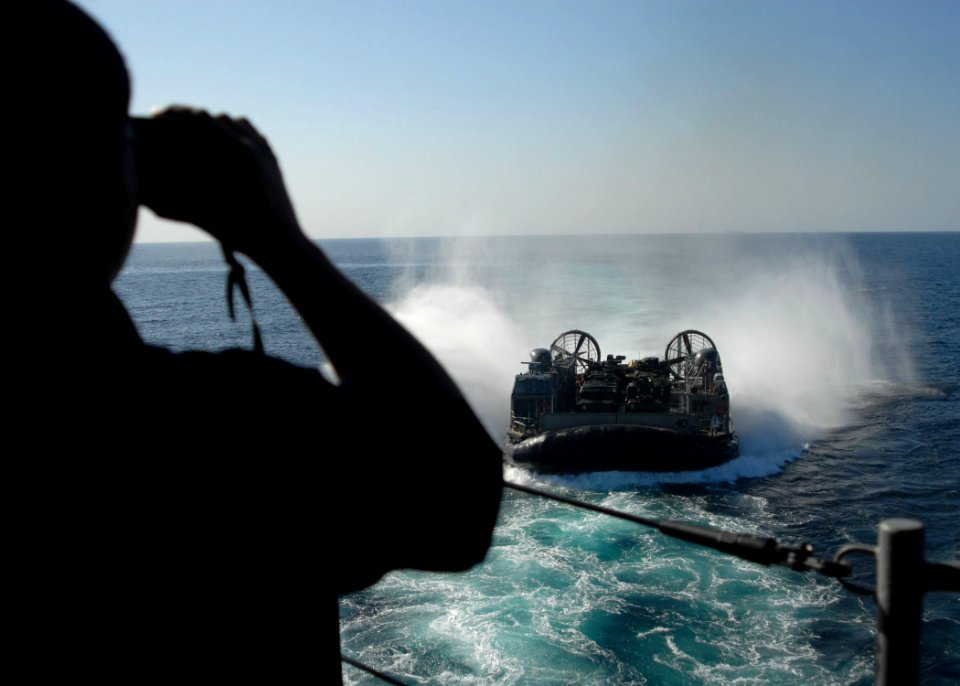US Navy 091113-N-8607R-011 The aft lookout stands the watch as s a landing craft, air cushion prepares to enter the well deck of USS Bonhomme Richard (LHD 6)