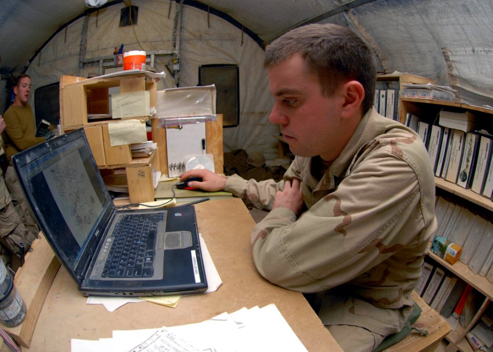 US Navy 091116-N-9564W-031 Construction Mechanic 3rd Class Patrick Witt, from Jacksonville, Fla. assigned to the cost control office of Naval Mobile Construction Battalion (NMCB) 74, researches a part using an electronic techni