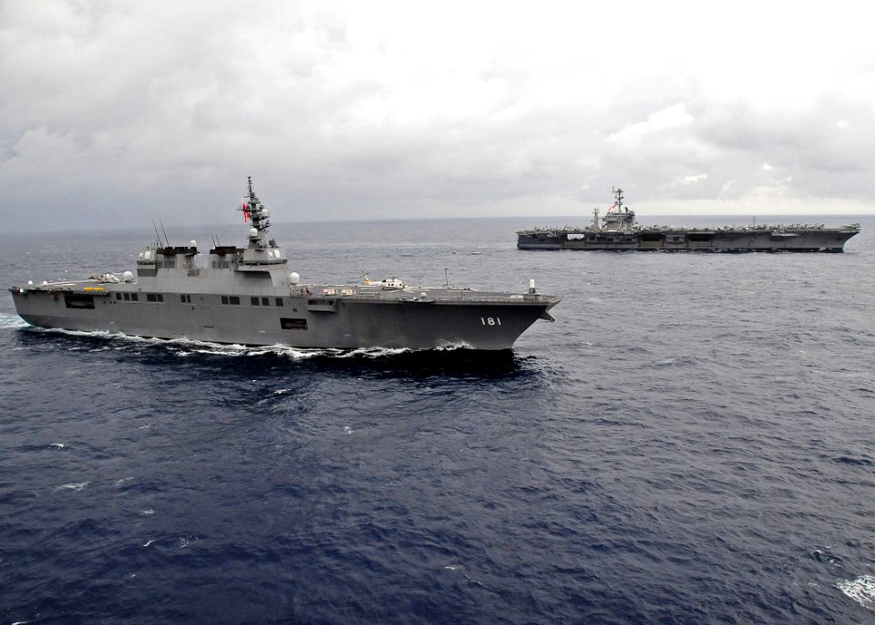 US Navy 091117-N-1644H-087 The Japan Maritime Self-Defense Force helicopter destroyer JS Hyuga (DDH 181) is underway alongside the aircraft carrier USS George Washington (CVN 73)
